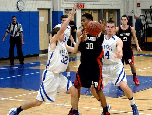 George Logan (left) and Danny Chapman (second from right) mark a Portland player closely in Saturday night's game.