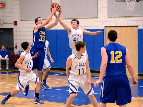 Sophomore Liam Corrigan  (#41) leaps high to block a ball in Thursday night's action at Lyme-Old Lyme High School.