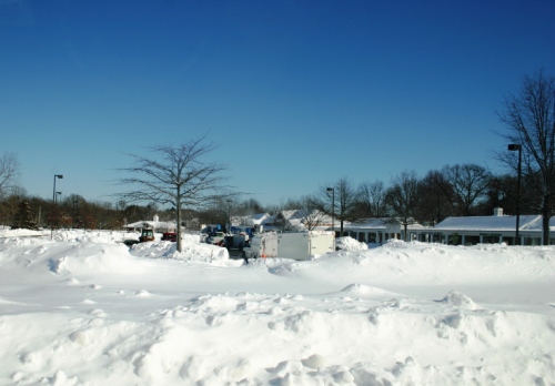 The Big Y parking lot was still awash with snow Sunday afternoon.