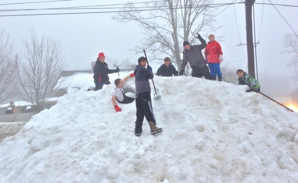 Kids_on_snow_pile_in_east_Haddam_by_H_Tyler