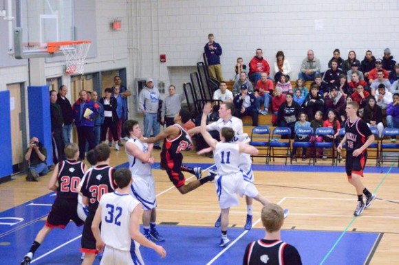 Slater Gregory blocks a Cromwell player during yesterday's semifinal.