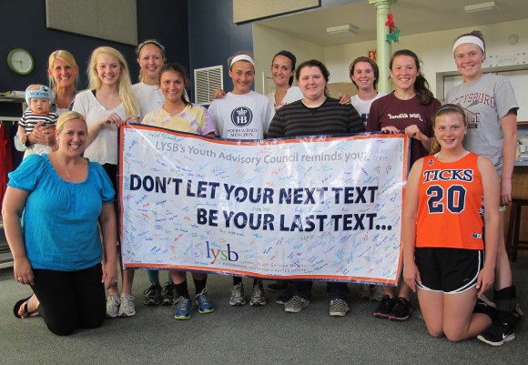 LYSB's Youth Advisory Council members stand proudly behind their message.