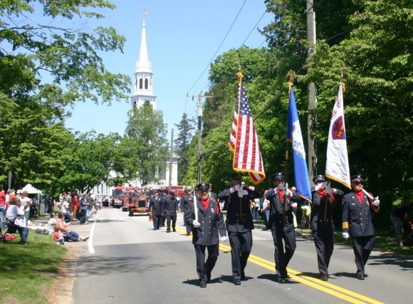 The parade heads down McCurdy towards the cemetery.