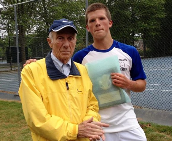 Morgan White stands proudly with his grandfather after winning the Shoreline Conference singles tennis championship.