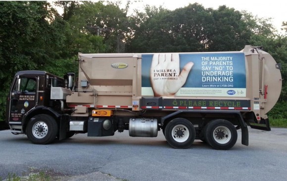 A CASFY banner displayed on a sanitation truck