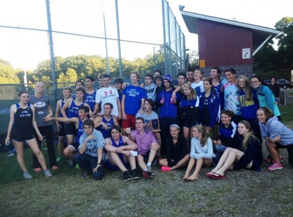 Celebrating the combined first place girls and boys trophy at Indian River in Clinton