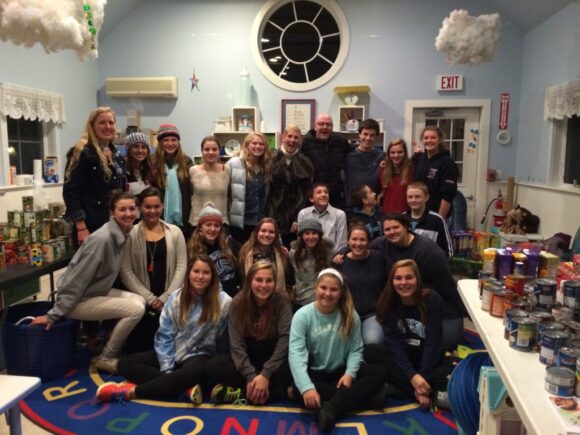 The fruits of their labors - members of the LYSB Advisory Council gather for a photo with Old Lyme Police officers after the recent Food Drive.