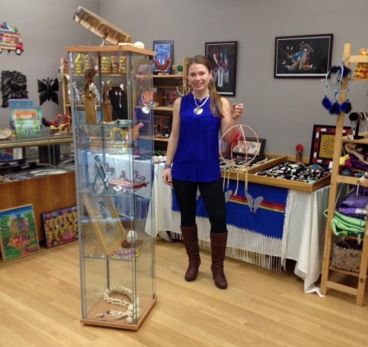 Tribal Crafts President Stephanie Kenny holds a dream catcher and stands among the Lakota and Haitian crafts, artwork and jewelry that will be showcased for sale the first two weekends of December for the Tribal Crafts Annual Holiday Sale, in the Old Lyme Marketplace (90 Halls Rd.) next to Jessie's Restaurant.