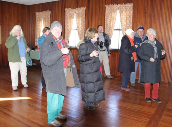 Members of the OLHS drink champagne to celebrate the acquisition of the The Grange by the Society.