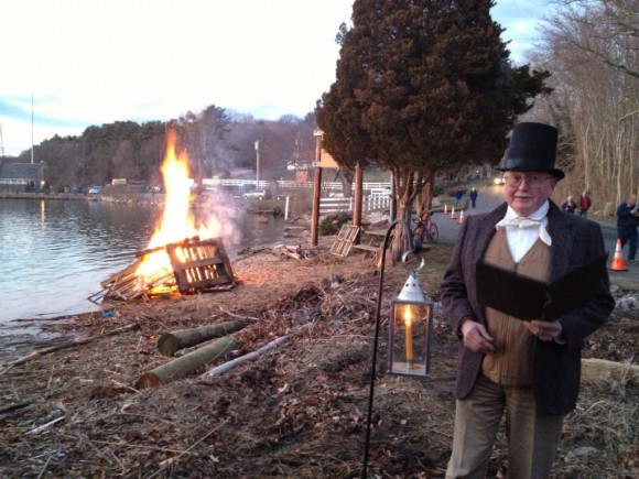 Mark Lander dressed inhistorical costume reads during the 'Light Up the Night' celebrations Tuesday evening.  Photos by Michaelle Pearson.