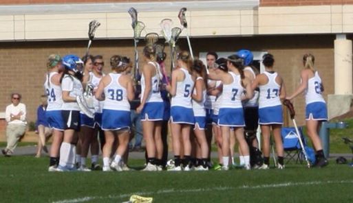 Sticks high.  The Old Lyme girls get ready for their game against Weston this afternoon.