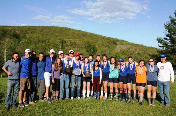 LOLHS rowing team members gather for a photo with their coaches.