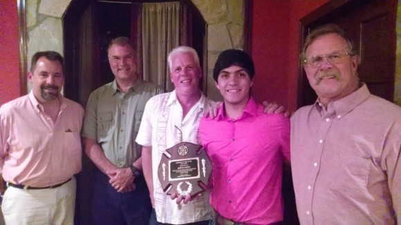  On May 30, 2014, International Student Exchange Exchange Student Erick Saenz of Chihuahua, Mexico received the "Rookie of the Year" Award for outstanding volunteer service to the Lyme Fire Company of Lyme, CT. Left to right, John Evans, Co-Engineer; Mark Wayland, 1st Assistant Chief of Hadlyme; Jamie Leatherbee, 1st Assistant Chief of Hamburg; Erick Saenz; and Tom Brown, Fire Chief.