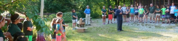 Michael Sage's father, Russell Sage, addresses campers and staff at Camp Claire.