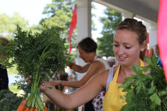 Photo courtesy of the Florence Griswold Museum.  Hard at work, but with a smile, at the Florence Griswold's En Plein Air Market!