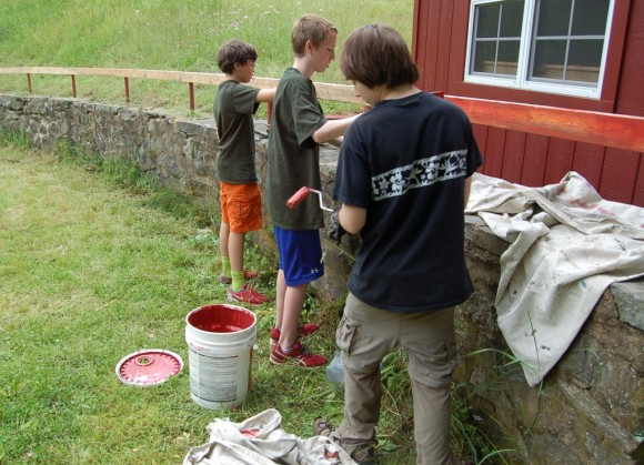 It Takes a Village - in this case, three young men, but there were many more on both days of the project - to fix an animal ring.