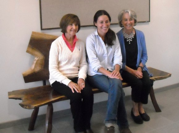 Taking a minute to enjoy the new bench are, from left to right,  Adrienne Brennan, President, The Friends of the Lyme Public Library; Seana Bill, Craftswoman; Judith Lightfoot, Chairwoman, Lyme Library Director's Board.