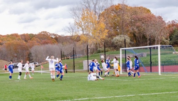 Almost all of the 22 players on the field in final goal-mouth scramble...