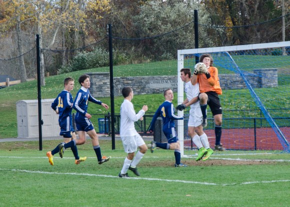 Nate Peduzzi challenges H-K goalie