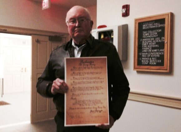 Mark Lander holds 'The Loving Parting Day' proclamation.
