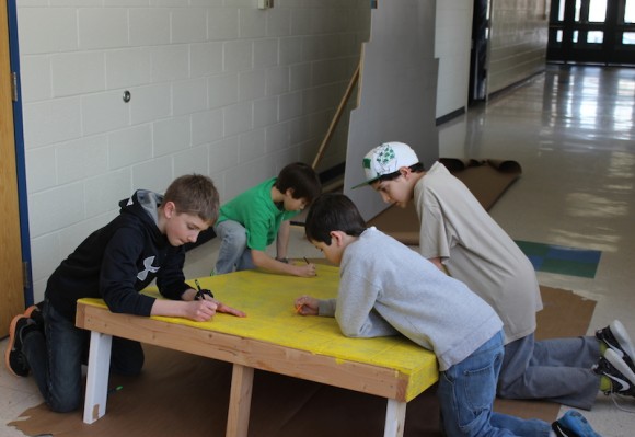 Parker Hubbard, Tanner Griffin, Liam Flanagan and Kevin Davidson prepare the Yellow Brick Road.