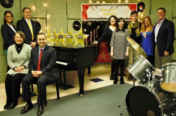 Looking forward to welcoming guests at Nights on Broadway are (standing L to R): Melissa Lieberman and David LaMay of Essex Financial Services; Robin Andreoli, CMS executive director CMS; vocalist Courtney Parrish; vocalist Richard Pittsinger; honorary co-chairs Jennifer and John Bauman. Seated are Laureen Sullivan of Essex Savings Bank and Charles Cumello, CEO of Essex Financial Services.