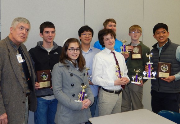The Lyme-Old Lyme High School Varsity Math Team proudly display their trophies