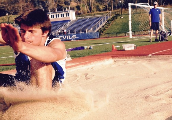 Buttrick lands in the sand after crushing the previous school record.