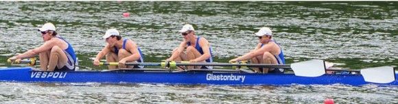 The crew of the boy's first boat show their determination to reach the winning line first.