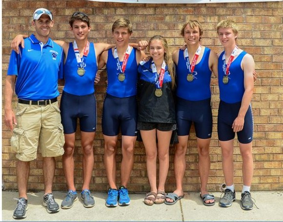 The boys second boat stand with their coach Louis Zubek and their medals. From left to right, Peter Fuchs, Adam Drummond, Julia Morrison (cox) Brandon Green and Jacob Olson.