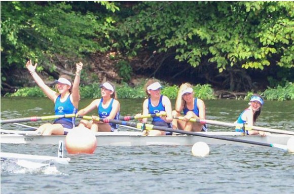 The crew of the girl's second boat celebrate their win.