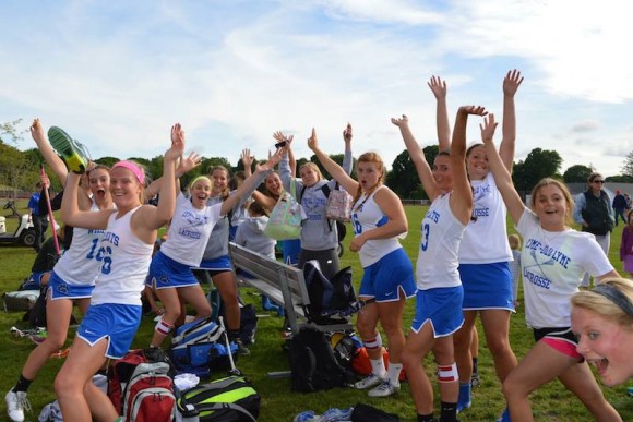 The Lady Wildcats celebrate their victory over Weston.