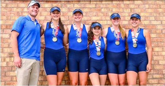 The crew of the girl's first boat proudly display their medals. From left to right, Steve Baranoski (coach), Christiana Congdon, Hannah Paynter, Claudia Mergy (cox), Allison Murphy and Maria Boyle.