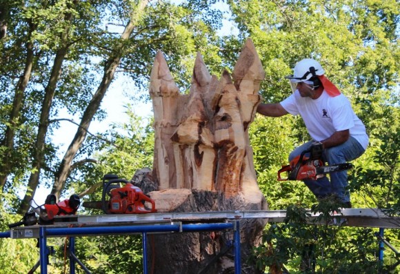 Jared is hard at work creating a magical castle from a tree trunk.