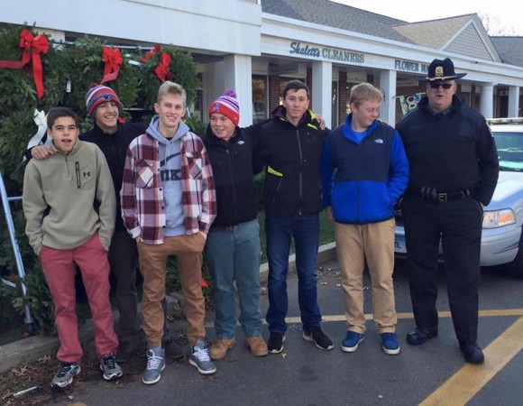 Members of the LYSB Youth Advisory Council stand with Old Lyme Police Officer Martin Lane at the recent Food Drive outside Big Y.