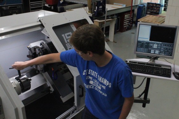 Advanced Engineering and Design student, Sam Frankel working on the CNC Lathe.