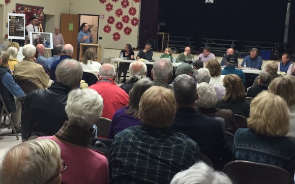 Matt Caruso, partner in The Sunset Hill Vineyard, addresses the Lyme Planning & Zoning Commission Monday at a packed hearing at Lyme Consolidated School on his vineyard's application for a special use permit to conduct tastings and sell wine at its farm on Rte. 156 and Elys Ferry Rd.