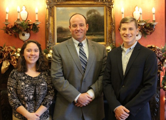 Region 18 Superintendent Ian Neviaser stands between Hattie and Brett Hartmann