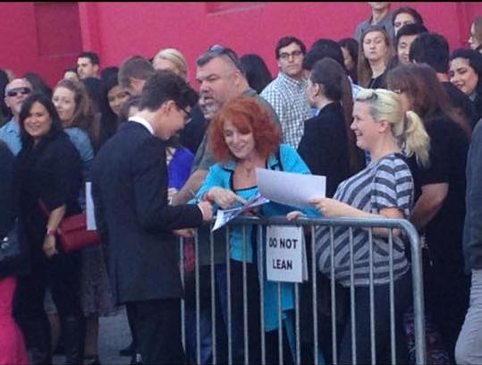 The star of the show ... Braiden signs autographs on his way into Tuesday evening's show.