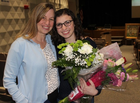 After being named Old Lyme's 2015 Citizen of the Year Mary Seidner receives a hug and a bouquet from her daughter Libby.