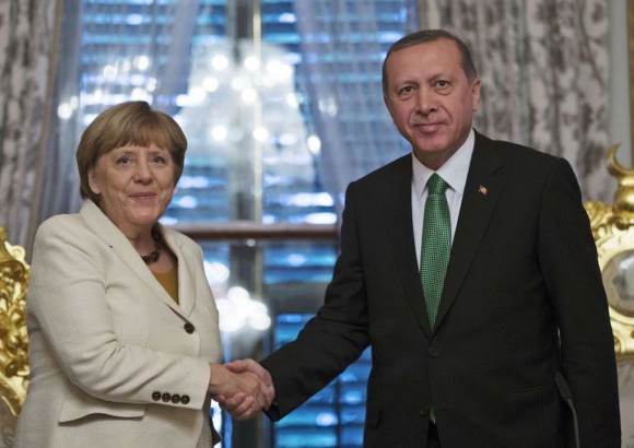 German Chancellor Angela merkel shakes hands with Turkish President Recep Tayyip Erdogan after the historic agreement between the European Union and Turkey.