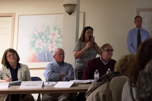From left to right, Selctwoman Mary Jo Nosal, Sound View Improvement Committee member Angelo Faenza, First Selectwoman Bonnie Reemsnyder (standing), SVIC member Pappalardo and a memebr of engineering member BSC listen to a question from the audience at Monday night's meeting.