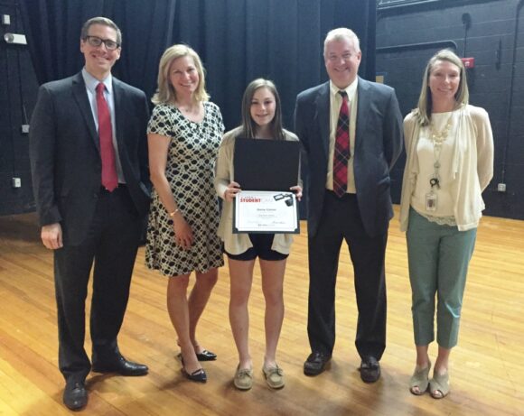 Standing with LOLMS eighth grader Daisy Colvin (center) after she was presented her award are C-SPAN RCommunity Relations Representatives Josgh (left( and Doug Bedig (second from right), LOLMS Principal Michelle Dean (right) and Comcast VP of Public Relations & Community Investment Kristen Roberts (Second from left).