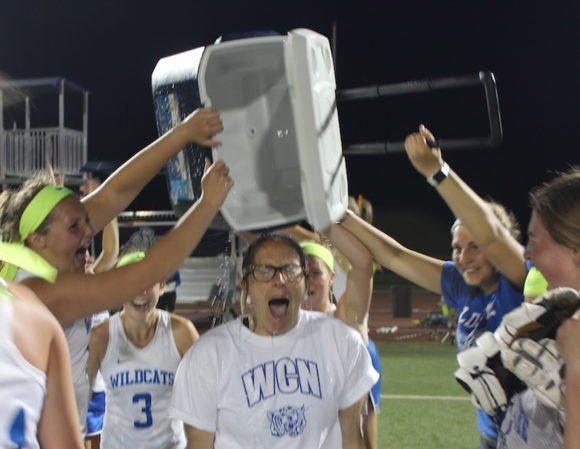 A drenching for coach Emily Macione -- the team celebrates in the traditional fashion!