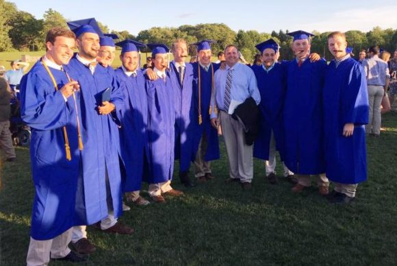 Lyme-Old Lyme High School baseball coach Randy St. Germain stands with graduating seniors from this year's varsity team.