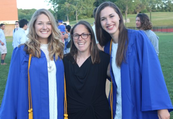 Commencement speaker Emily Macione stands between graduates Sophia Romeo (left) and Samantha Lee.