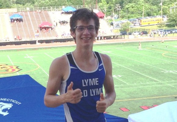 Lyme-Old Lyme High School senior Will DeMott celebrates his success after breaking the 35-year-old LOLHS record for the 3,200 meters.
