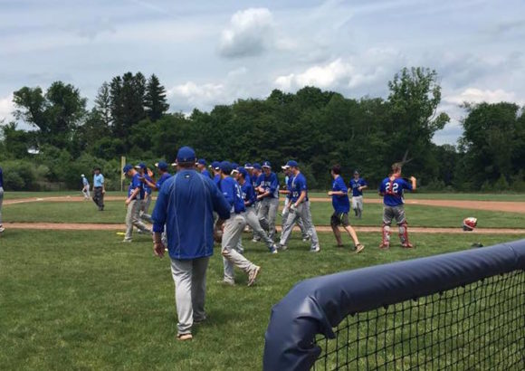 Coach Randy St. Germain strides out towards his team after their victory Saturday afternoon over top-seeded Oxford HS. Photo by Kristen St. Germain.