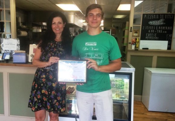 DaVinci Pizza receives its Certificate of Appreciation from the Old Lyme PGN Library Children's Librarian.