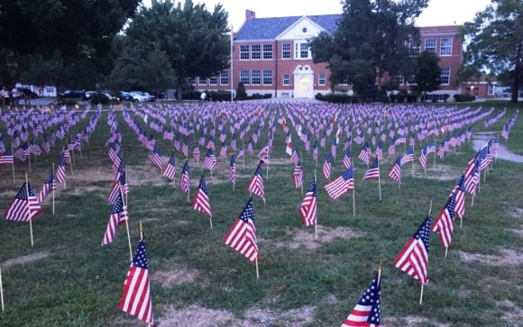 Twenty none hundred and sevent seven flags stand in front of Old Saybrook Town Hall in memory of the 2,977 lives lost on this day 15 years ago at the World Trade Center in New York Center.